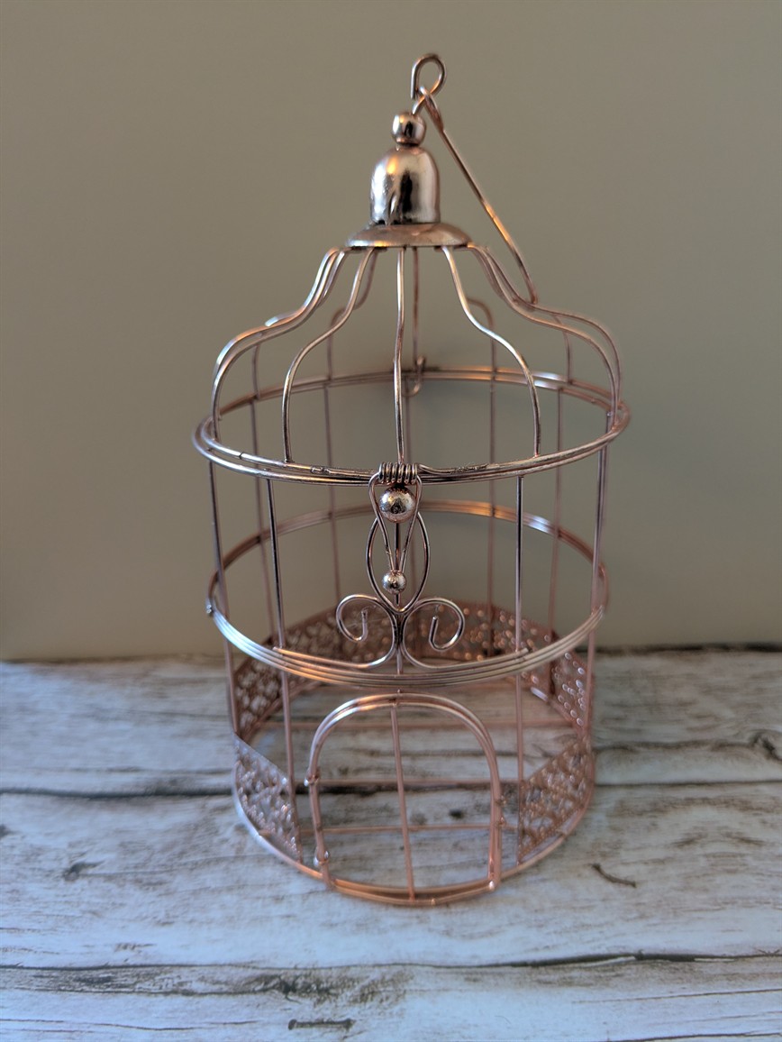 Cage à oiseau rose cuivré